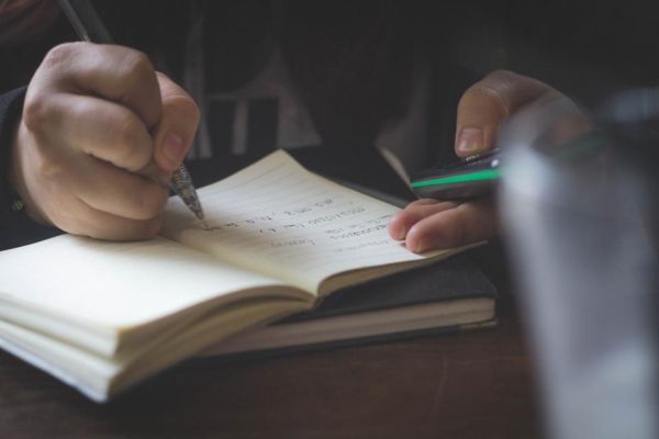 A notebook and pen on a study desk